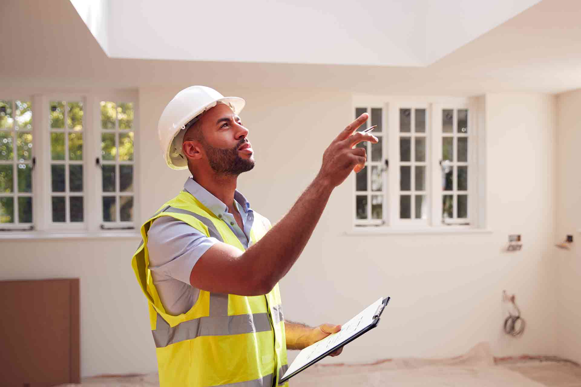 Third Party Wall Surveyors York reviewing plans between two parties during a dispute